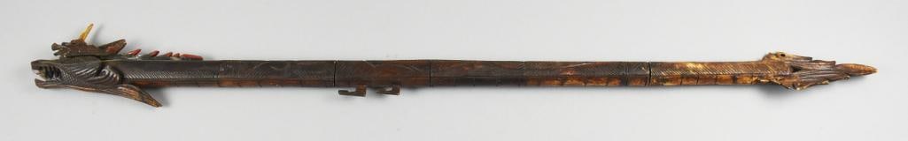 Chinese Hand Carved Bone, Dragon Blow Pipe: This very cool piece appears to be of Chinese origin. Hand carved, appears to be bone with dragon head and all stained brown. Dart blow looks like it comes apart in multiple places, we removed one sec
