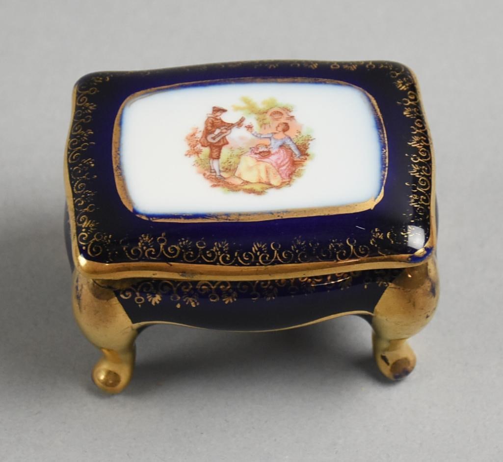 Vintage Lemaire Limoges France Porcelain Cobalt Footed Trinket: Lovely vintage porcelain footed trinket box is Lemaire Limoges France. Darling courting scene on removable lid, rich cobalt glaze and heavy gold gilt. It is marked inside the lid. Measures approx.?2" 