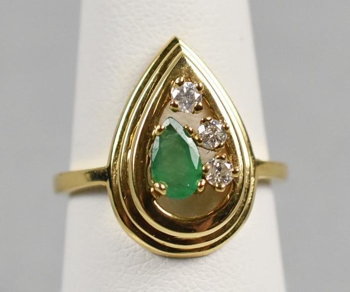 14k Gold Emerald & Diamond Teardrop Ring: 14K Yellow Gold Teardrop Ring with Emerald & Diamonds This stunning ring is in 14K yellow gold. Teardrop shaped gold set with .25 cttw emerald, also teardrop and three round cut diamonds. Stamped insi