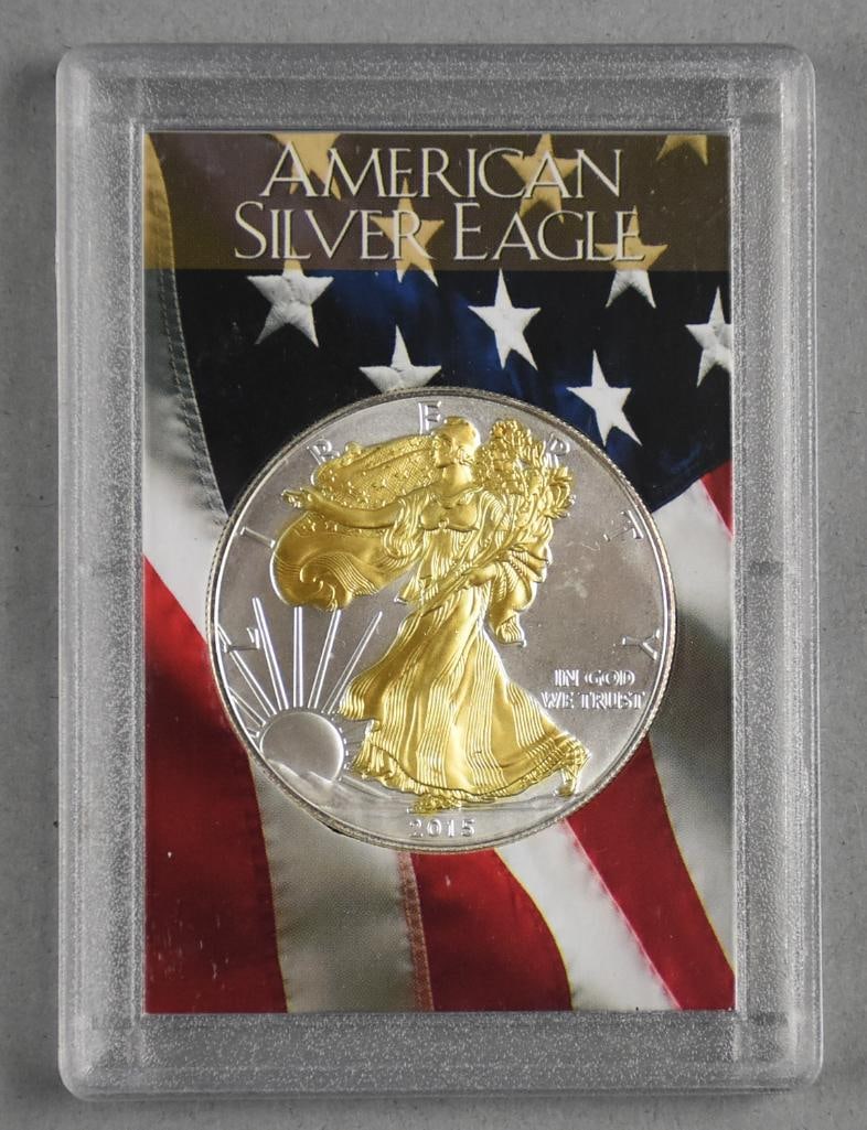 2015 1 oz. Fine American Silver Eagle Dollar Uncirculated: Lot is a 2015 1 Troy oz. Fine American Silver Eagle Dollar Gold Colorized Uncirculated.