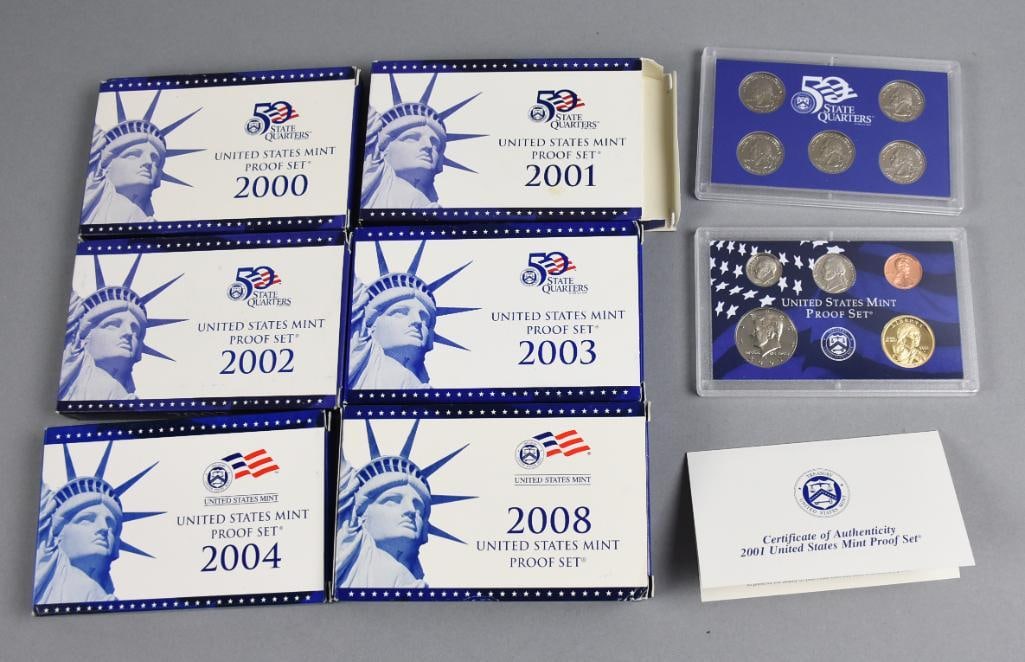 2000-04 U.S. Mint Proof Sets & 2008 State Quarters: Lot is six 2000-04 and 2008 United States Mint Proof Coin Sets. Each set includes proof coins issued for the respective year, showcasing sharp details and mirrored finishes. Includes original packagin