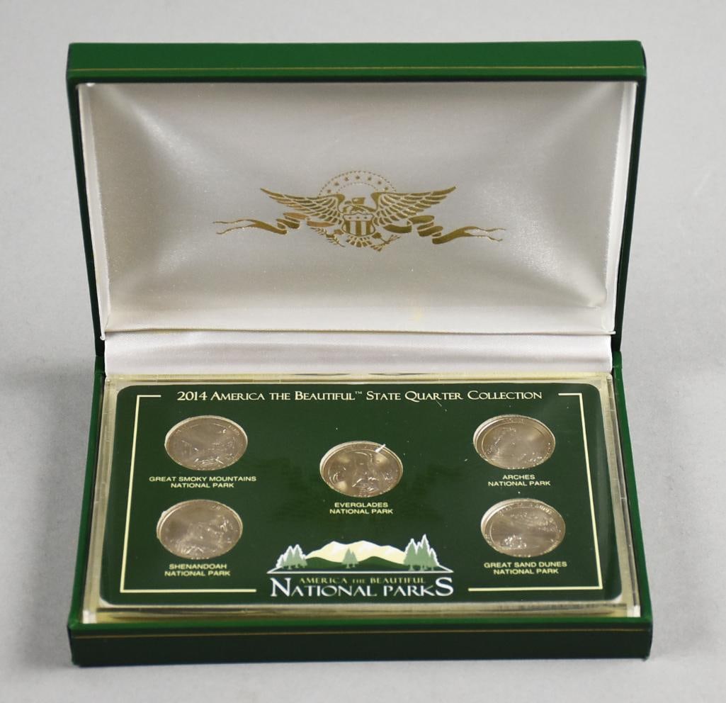 US Commemorative Gallery America's Beautiful National Parks Quarters: 2014 America the Beautiful State Quarter Collection featuring five uncirculated quarters. Each coin represents a U.S. National Park: Great Smoky Mountains, Shenandoah, Arches, Great Sand Dunes, and Ev