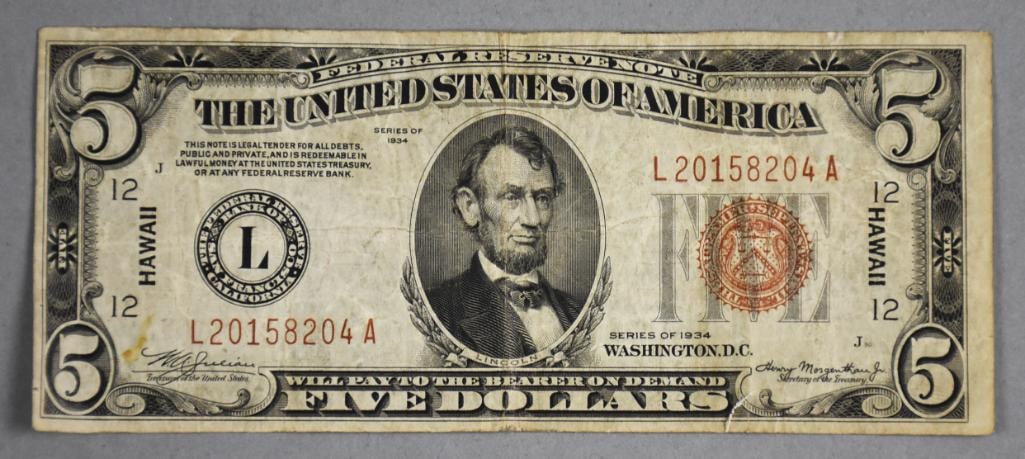 1934 Hawaii Overprint $5 Federal Reserve Note: 1934 Hawaii overprint $5 Federal Reserve Note featuring a portrait of Abraham Lincoln on the front and an image of the Lincoln Memorial on the back. The bill includes the distinctive 'Hawaii' overprin
