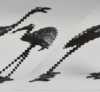 Vintage Japanese Bronze Heron Pair: These cute pieces are Japanese and appear bronze. These herons in two different poses would look great inside or out. No visible marks and stand approx. 5" and 6" tall.?These pieces were in a Japanese