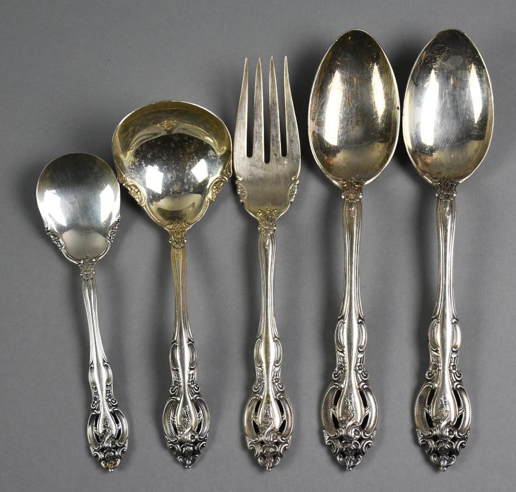1964-2019 Gorham Sterling La Scala Flatware Assortment: These pretty pieces are Gorham sterling. The pattern is called La Scala, introduced in 1934, discontinued in 2019. The handles are pierced with scroll work and flowers. Each measure from 6.5" to 9" wi