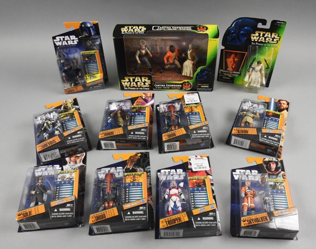 (11) 1990s-00s Hasbro Star Wars Action Figures-MIP-NOS: Lot is 11 1990s-00s Hasbro Star Wars Action Figures-MIP-NOS. Includes Solo, Droid (2), Trooper, Skywalker, Kenobi, Windu, Grievous, Fett, Princess Leia and a three pack, Cantina Showdown. Single owner