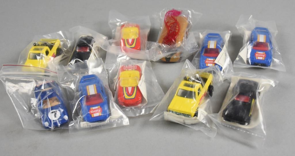 (11) 1980s-90s Mattel Hot Wheels Promotional Die-Cast-NOS: Lot is 11 1980s-90s Mattel Hot Wheels Promotional Die-Cast-NOS. All in original plastic packaging with information tags inside. Single owner collection from the largest toy collector on the West Coast