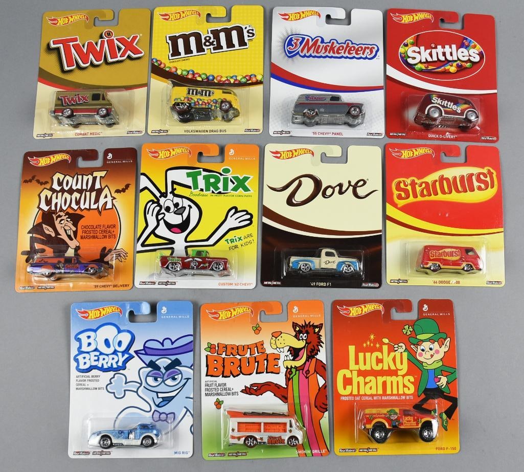 (11) 2013-14 Hot Wheels Candy & Cereal MOC-NOS: Lot is 11 2013-14 Mattel Hot Wheels Candy & Cereal-MOC-NOS. Includes Count Chocula, Trix, Boo Berry, Frute Brute, Lucky Charms, Twix, Starburst, Dove, Skittles, 3 Musketeers and M&Ms. Single owner col