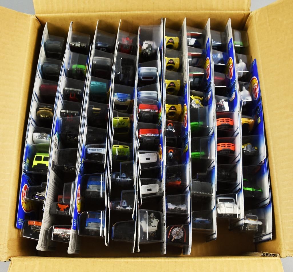 70 1990s Mattel Hot Wheels Various Lines Factory Case: Lot is a 1990s 70pc Mattel Hot Wheels Factory Case, Large Assort.-MOC-NOS. Cars are: Guaranteed For Life, First Editions, Tropicool Series, Flying Aces. Case appears to be original. Single owner colle