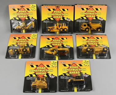 (8) 1994-95 Ertl Road Construction Ahead Die-Cast-MOC-NOS: Lot is eight 1994-95 Ertl Road Construction Ahead Die-Cast-MOC-NOS. Includes John Deere, Caterpillar and Ford. Single owner collection from the largest toy collector on the West Coast.