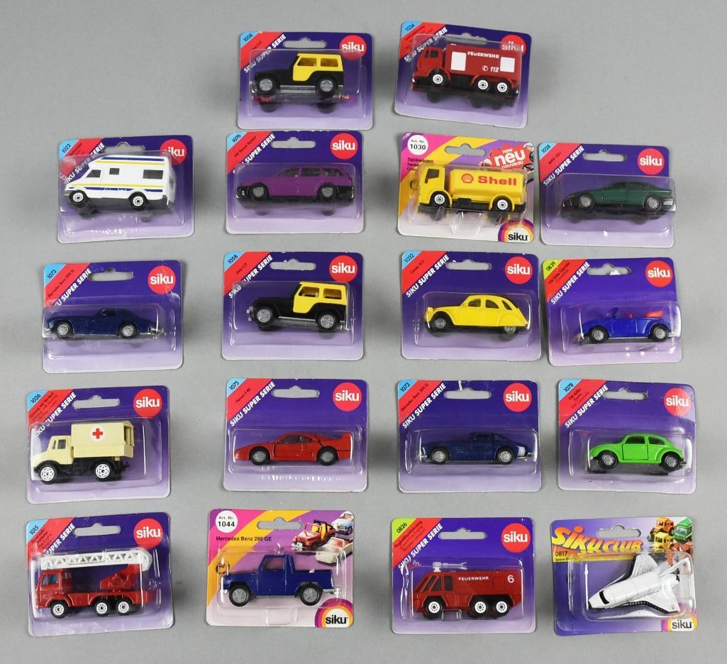 (18) 1980s Siku Super Serie Die-Cast Assortment - MOC NOS: Lot is 18 1980s collection of 16 Siku die-cast vehicles, all in their original unopened packaging. The collection features a diverse assortment of models, including emergency service vehicles, classic