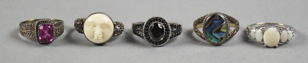 Vintage Sterling & Semi Precious Stone Ring Assortment: Pretty collection of sterling rings with stones. Gemstones appear to be black spinel, abalone, ox bone moon face, opal and amethyst. Each stamped 925 with no other visible marks.