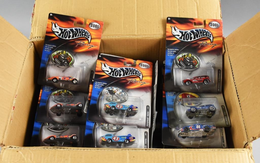 (79) 2000s Mattel Hot Wheels Die-Cast Assortment-MOC-NOS: This lot includes (79) pieces of Hot Wheels die cast cars. This lot features a variety of 2000's basic Hot Wheels, Hot Wheels Racing, and more. This box is a mix of NOS, and each card has never been o