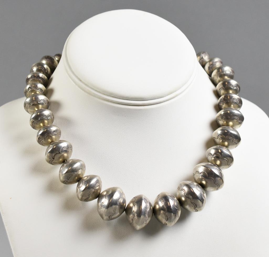 Navajo Sterling Squash Bead Choker: Wonderful vintage choker is attributed to Navajo jewelry artist Each bead is stamped with small arcs, believed to be symbols for clouds. No visible marks. From the home of a collector, dealer, apprais