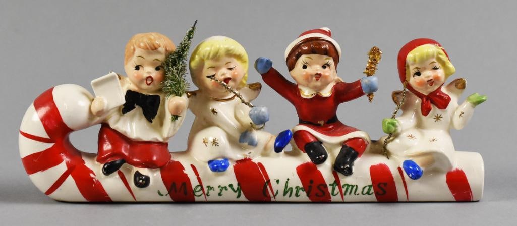 Vtg Commodore Porcelain Christmas Candy Cane Sleigh: Wonderful Christmas figure from Commodore in Japan. Porcelain candy cane sleigh with four different characters. Retains original gold foil label on bottom. Measures approx. 3" x 9".?