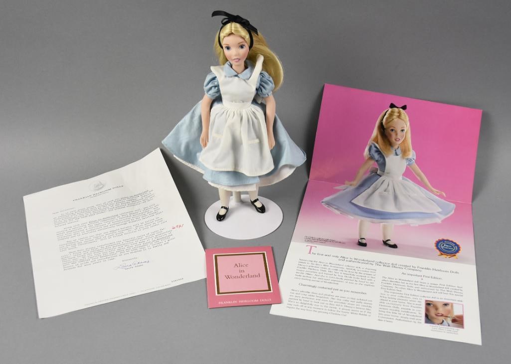 Franklin Heirloom Disney's Alice in Wonderland Doll 1st Ed: Sweet 12" tall doll from the Franklin Heirloom collection and she is Alice in Wonderland. She is a first edition, bisque shoulder head and cloth body. Stamped on shoulder plate. Comes with all paperwo
