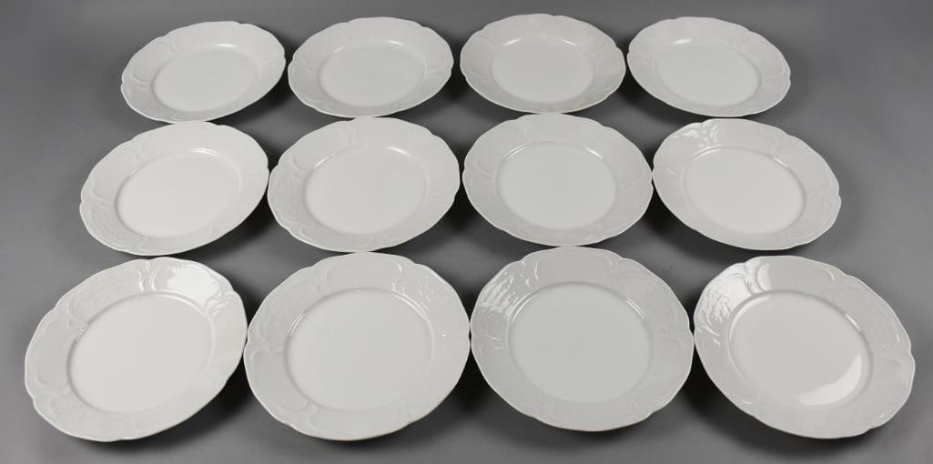 German Rosenthal Porcelain Dinner Plates, Embossed Rims: Lovely set of 12 porcelain plates from Rosenthal, German made. White dinner plates with embossed scrolled vine details around the rim. Each measures approx. 10" across. From the home of a collector, d
