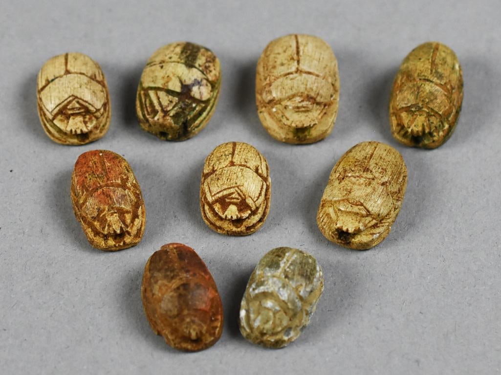 Grouping of Nine Egyptian Scarabs: Cool grouping of nine scarabs. They have not been researched, possibly ancient and or modern. All with hieroglyphs on the reverse. Measure from approx.