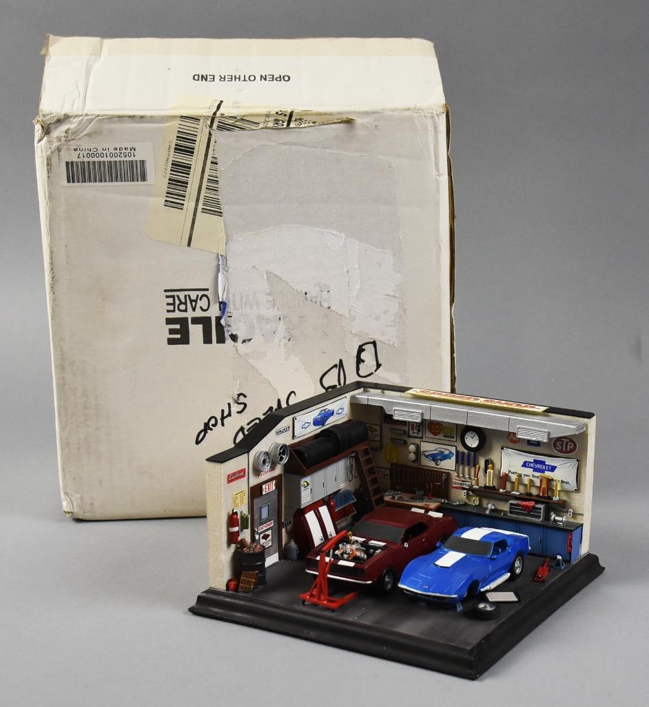 Danbury Mint The Speed Shop Garage Diorama, MIB: Awesome Danbury Mint Speed Shop diorama. This garage has a Corvette and what appears to be a classic Camaro?with all you expect to see in a mechanic's garage.?This item comes from a very passionate Di