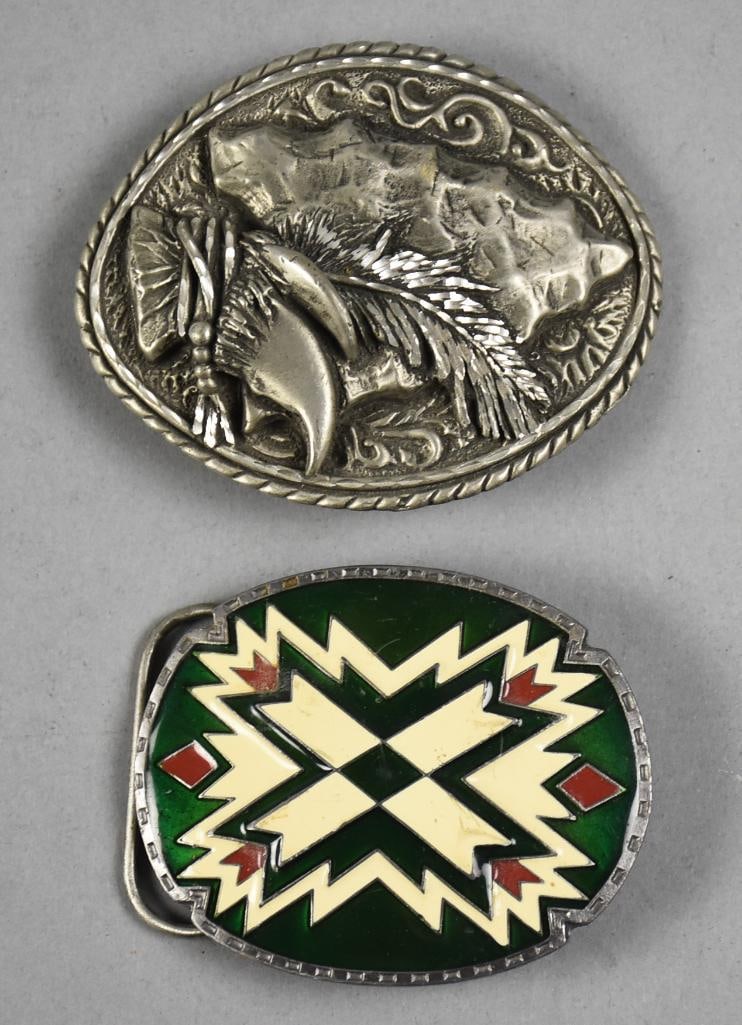 Vintage Ege and Siskiyou Native American Style Belt Buckles: Lot is a pair of very nice vintage belt buckles. The Ege from 1993 is an arrowhead with feather and talon, the Siskiyou with enamel design. Measure approx. 2.5" x 3" and 3" x 4".