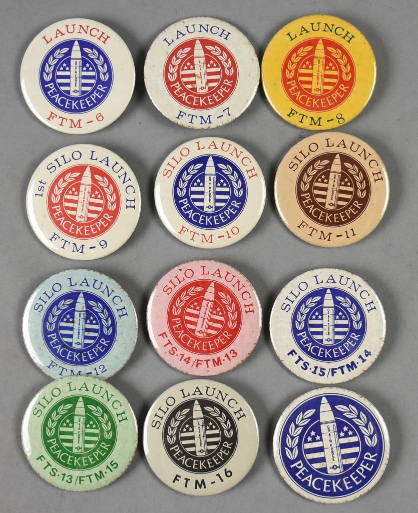 (12) Vintage NASA Peacekeeper Launch Pinbacks-SCARCE: Great assortment of vintage NASA Peacekeeper Launch pinback buttons. They are super hard to find and each button represents a launch date starting with #6 on October 1, 1984, #9, the First Silo Launch