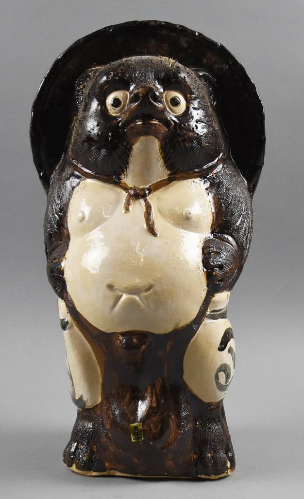 Vintage Japanese Earthenware Tanuki Sculpture: This fun piece is a Japanese Tanuki sculpture that appears to be earthenware. Retains original label and stands approx. 19" tall. This piece was in a Japanese decor shop in Little Tokyo near downtown