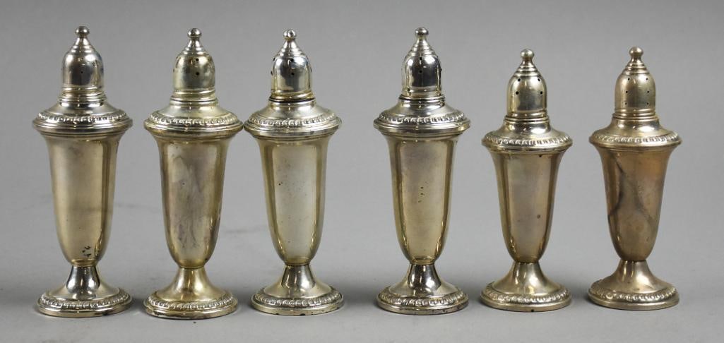 Vintage Empire Sterling Weighted Salt & Pepper Shakers: These wonderful vintage salt and pepper shakers are all Empire. Each is a classic urn shape with gadroon details around rim and base. Well marked on bottom and weighted. Each is approx. 5" tall and ov