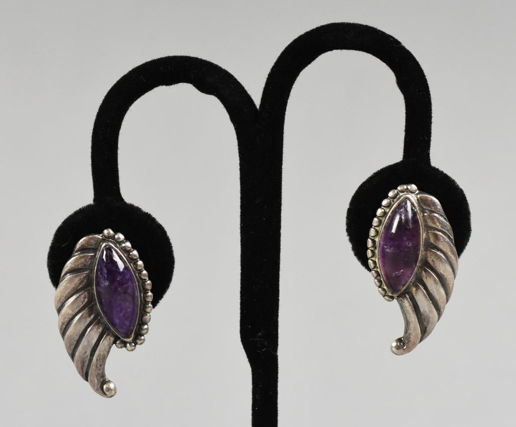 Vintage Mexican Sterling & Amethyst Earrings: Gorgeous pair of vintage Mexican sterling earrings. Each is a stylized wing and cabochon amethyst stone. They are very well marked, unable to see a designer mark. From the home of a collector, dealer,