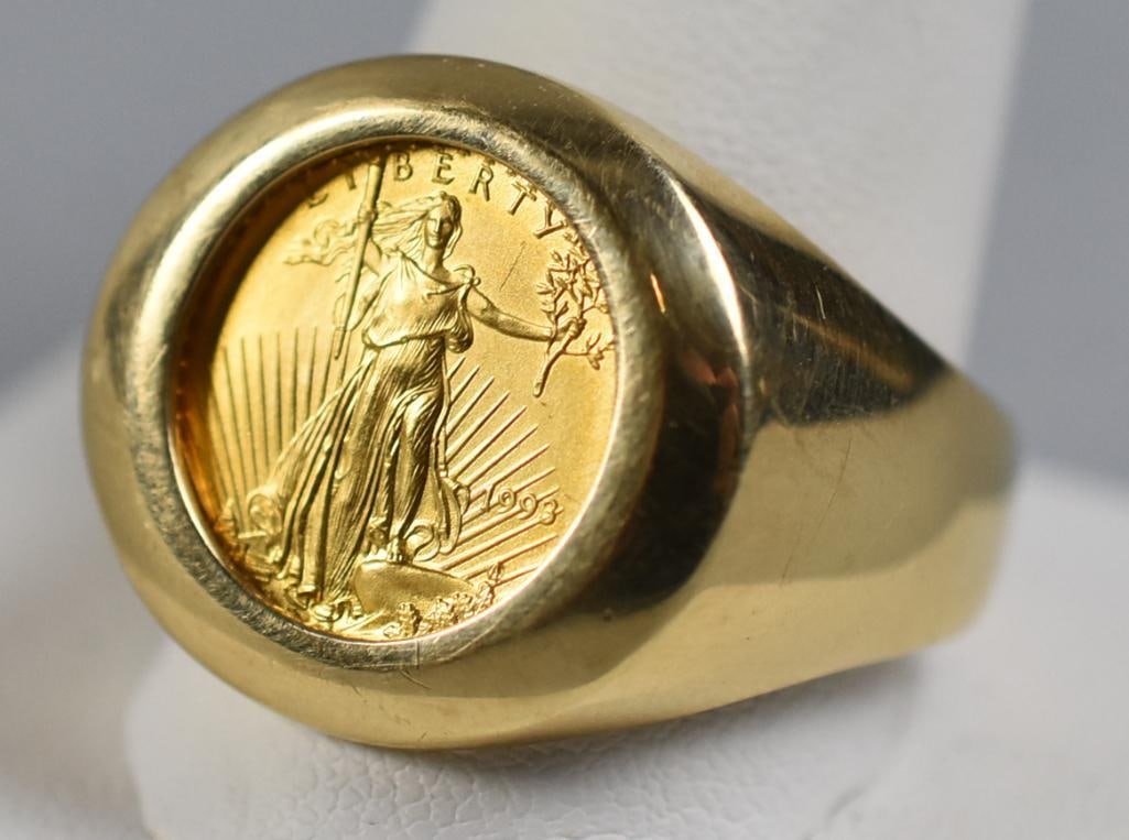 10K Yellow Gold 1993 American Eagle Coin Ring: This cool ring is 10K yellow gold. It is set with a gold 1993 American Eagle coin ring. It is stamped inside the band with an unidentified maker mark. It is approx. 15.2 grams, size approx. 14.