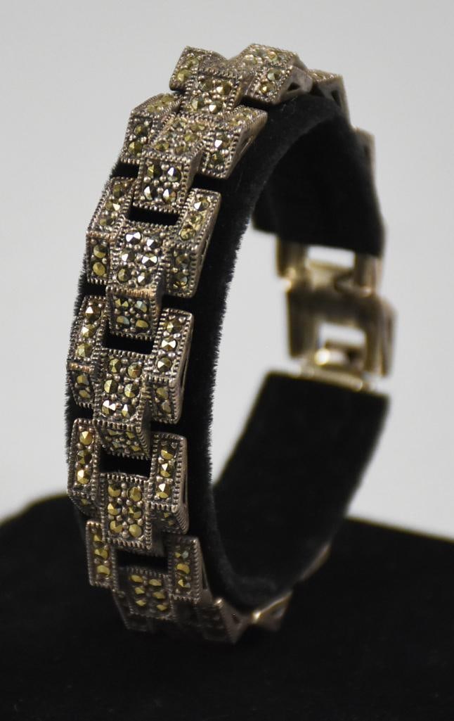 Vintage Art Deco Style Sterling Silver & Marcasite Bracelet: Stunning vintage bracelet in sterling silver. Art Deco link style set with multiple sparkling marcasites. Locking clasp is marked 925, no visible designer marks.