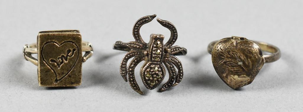 Poison Rings Sterling Silver Hearts & Spider: Great lot of vintage sterling silver rings, each is a poison or snuff style. Rings include a spider with marcasite, a rectangle with heart and puffed heart. All rings stamped 925, spider ring with uni