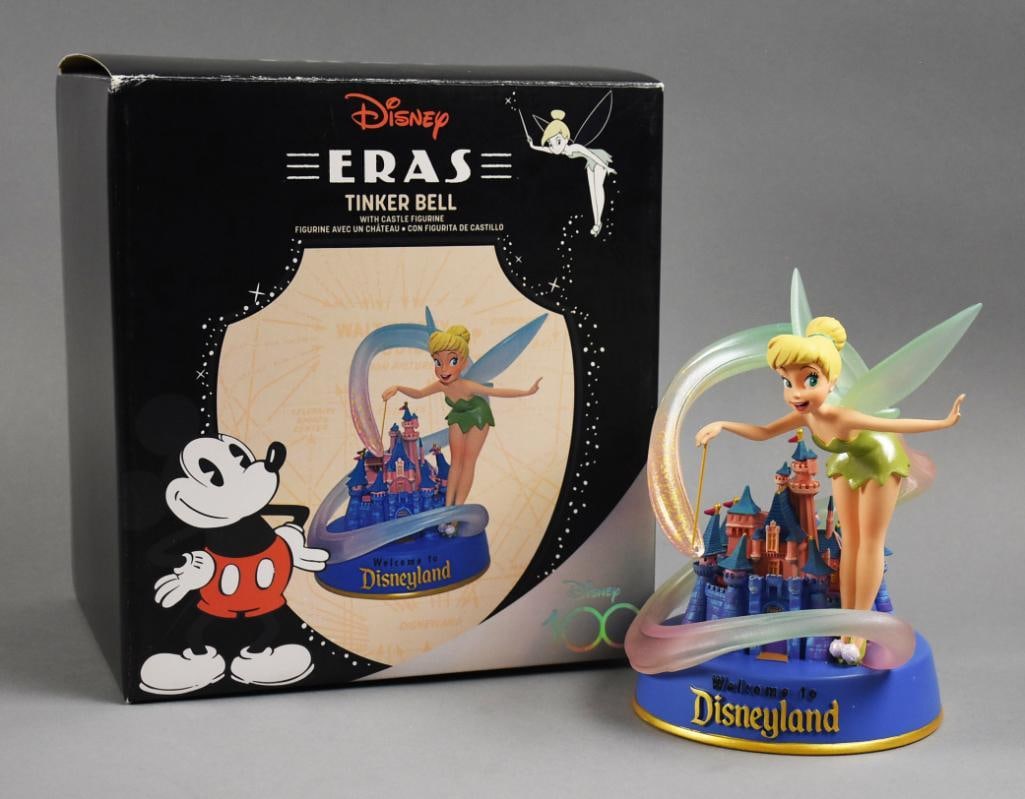 Disney Eras Tinkerbell Figure 100 Years of Wonder MIB: Celebrating 100 Years of Wonder is this Disney Eras figure. It is Tinkerbell waving her wand over Sleeping Beauty's castle. Comes in the original box.