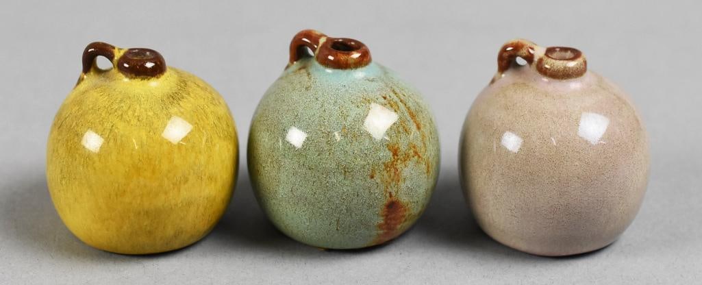 Nicodemus Art Pottery Ferro-Stone Miniature Jugs: This lot is three adorable Nicodemus pottery jugs. Each is created using ferro-stone clay and each with high gloss translucent glazes, white, blue and yellow. No visible marks, possibly under the orig