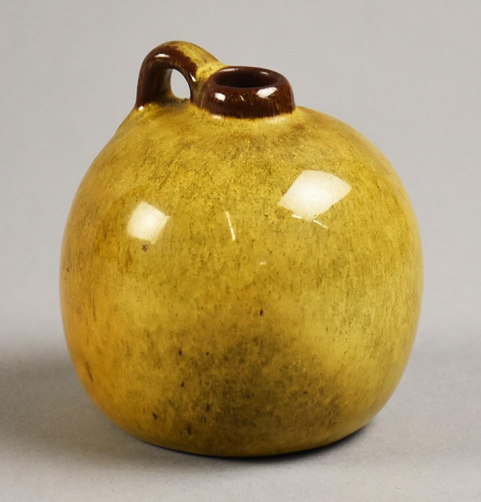 Nicodemus Art Pottery Ferro-Stone Yellow Jug: Darling vintage Nicodemus art pottery jug. Created with ferro-stone clay and a high gloss yellow translucent glaze. Nicely marked and stands approx. 3" tall. Chester Nicodemus (1901-1990) earned his d