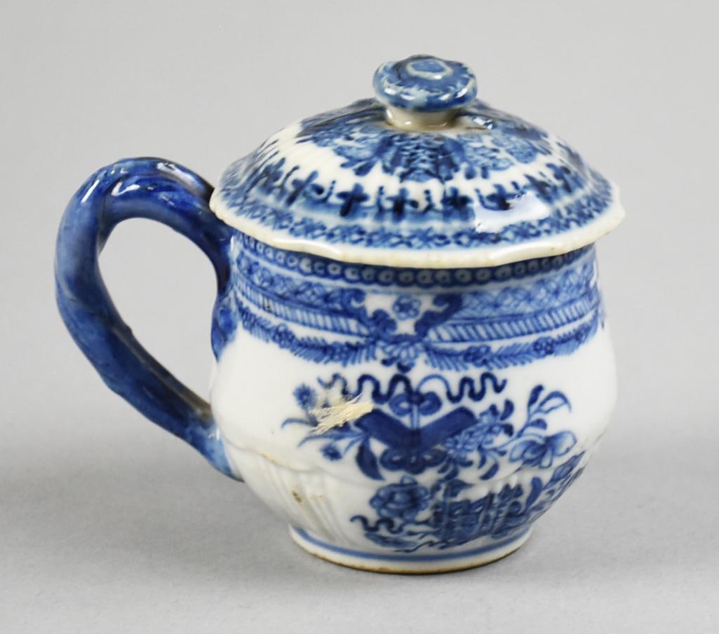 Qing Dynasty (Qianlong) Blue & White Porcelain Lidded Cup: Awesome porcelain cup believed to come from the Qianlong period during the Qing Dynasty. Blue and white under glaze?foliate with swags and twist handle. No visible marks, measures approx. 3" x 4" incl