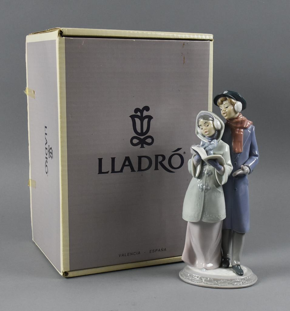 Lladro Porcelain Christmas Melodies No. 6128, Original Box: Lovely retired Lladro porcelain figurine called Christmas Melodies, No. 6128. Sculpted by Francisco Polope and issued in 1994. Figure was retired in 1997. Comes in the original box.