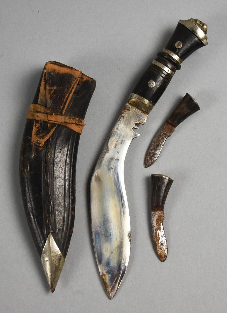 Antique India Gurkha Fighting Knife w/ Three Blades: Great antique piece from India. It is a Gurkha fighting knife. This knife comes with sheath that appears leather. Tucked in with the main blade are two small blades, handles appear ebony wood. Overall