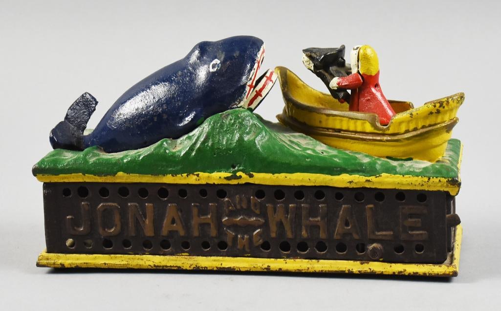 Vintage Jonah & the Whale Mechanical Cast Iron Bank: Very cool vintage cast iron novelty bank. It is the Jonah & the Whale with a small coin tray in Jonah's hands, press the lever, the whale opens his mouth and the coin goes in. These were originally cr