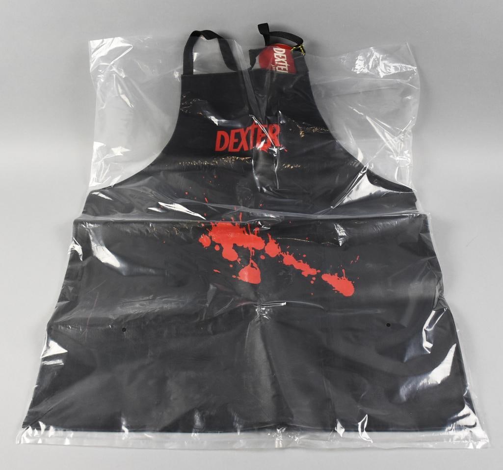 Dexter Splatter Apron 2011 ThinkGeek Showtime MIP NOS: This very hard to find bib apron is for the Showtime hit Dexter. Designed by ThinkGeek, black apron with faux blood spatter is black faux leather and red graphics. Still in original plastic packaging.