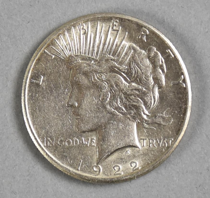 1922 Silver Peace Dollar: No mint mark on this 1922 silver Peace dollar.