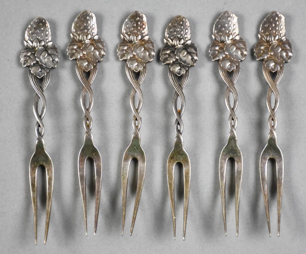 c1875 Tiffany & Co Strawberry Twist Handle Fork: This is a gorgeous set of six Tiffany & Co sterling forks. Strawberry handle end with twist handle and two tine strawberry forks. Each fork is marked on back of stem handle T & CO STG. Measure approx.