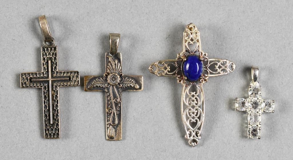 STS & More Sterling Silver Cross Assortment: Pretty assortment of sterling silver crosses, one with a blue stone that appears to be lapis, one appears to have cubic zirconia. They are all marked.