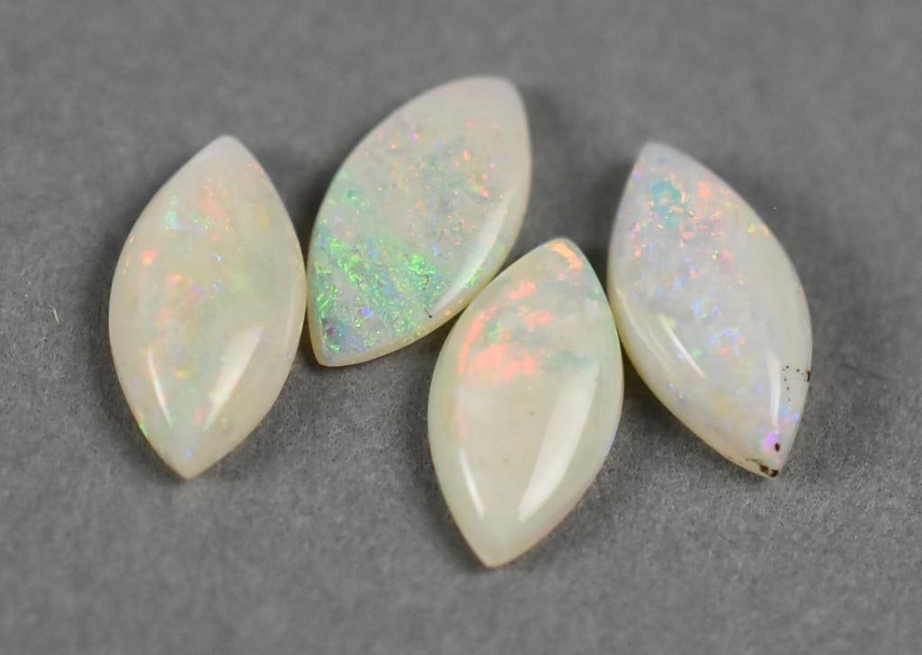 2.45 Ct Opal Marquise Cut Cabochon: These four opals are cabochon in marquise shape. All are roughly the same size total approx. of 2.45 carats.?