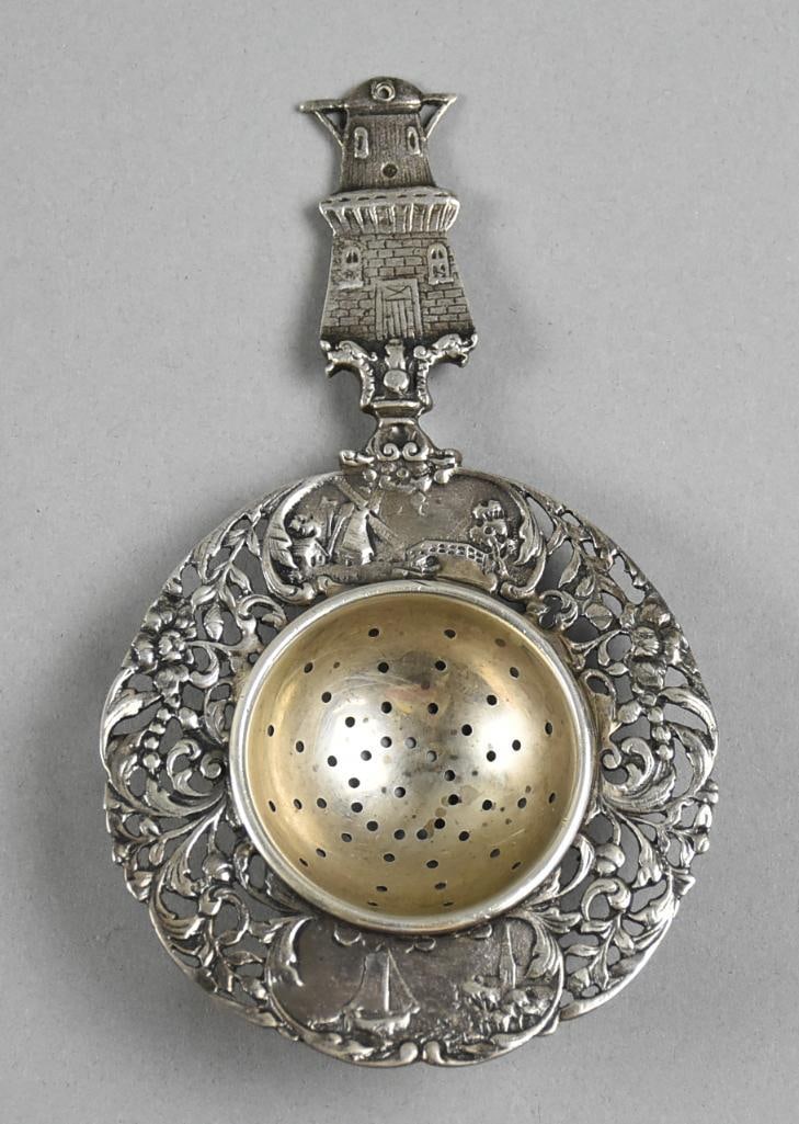 Vintage Dutch Style Sterling Silver Tea Strainer: Beautiful piece of vintage sterling in Dutch style. Handle is a windmill, pierced bowl surrounded by low relief windmills and boat with flowers and scrolls. Stamped on back Sterling 119. Approx