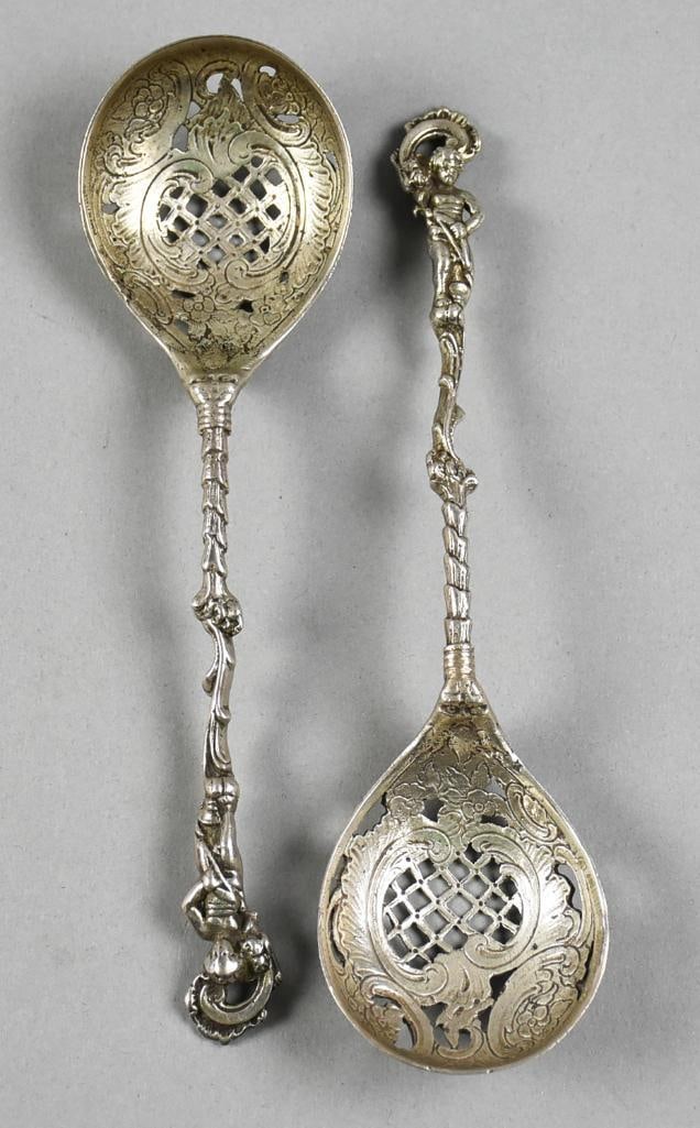 Antique Italian 800 Silver Figural Putti Sugar Sifter Spoons: Lovely pair of antique Italian sugar sifter spoons. Putti figural and ornate handles. Bowls with ornate foliate and C scroll details. Each is marked Made in Itally 800, appears to be stamped with desi