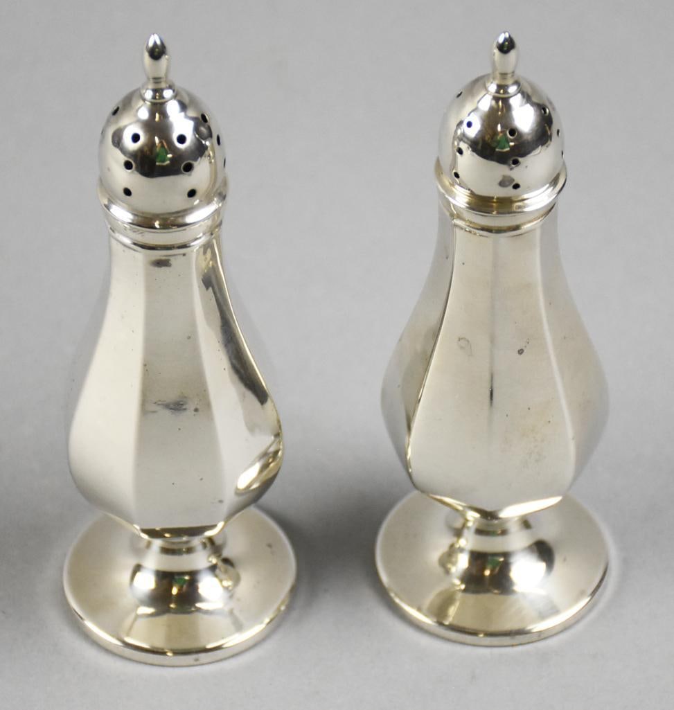 c1930 M Fred Hirsch Sterling Salt, Pepper Shakers Hollowware: Wonderful vintage salt and pepper shakers from M. Fred Hirsch Co. Panel style from the 409 collection. Each is well marked on bottom. Stand approx. 5.5" tall with an approx. weight of 128 grams.