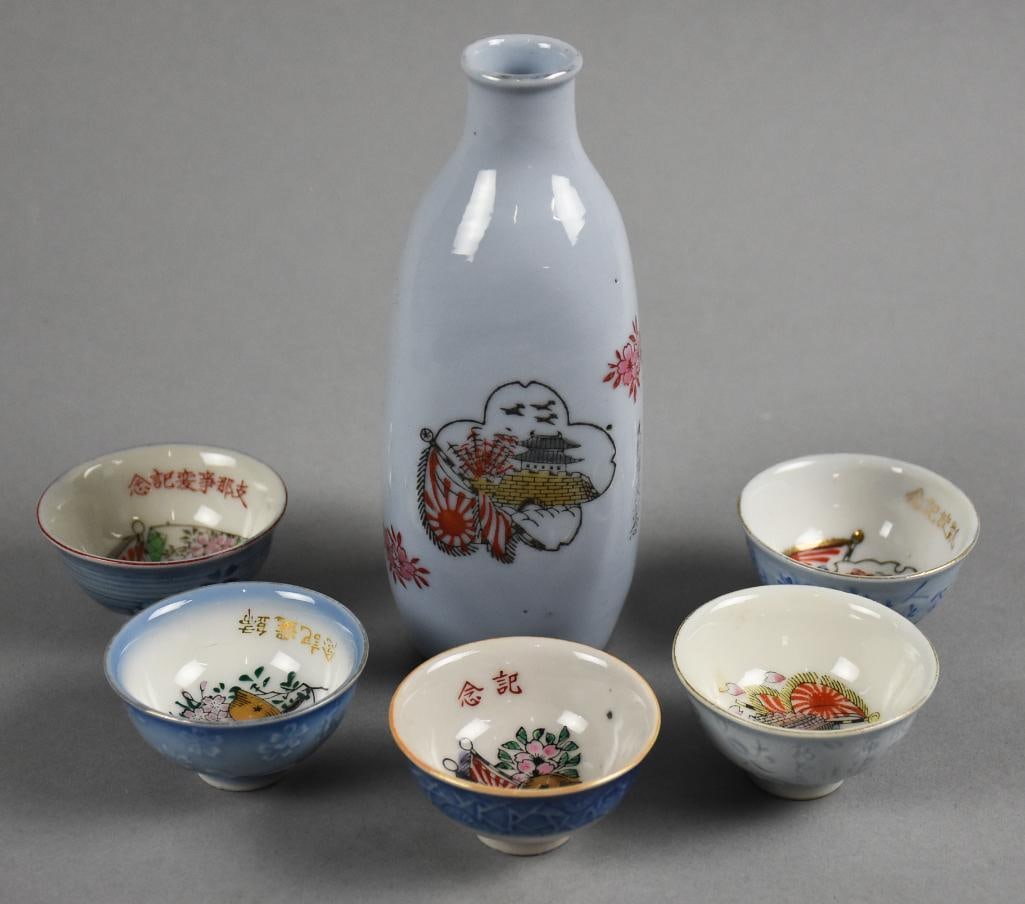 Collection of Kutani ware Japanese military sake cups: A collection of Kutani ware Japanese military sake cups. These cups, also known as sakazuki or ochoko, were often used in ceremonies or celebrations.? Material and Style: Kutani ware is a type of Japa