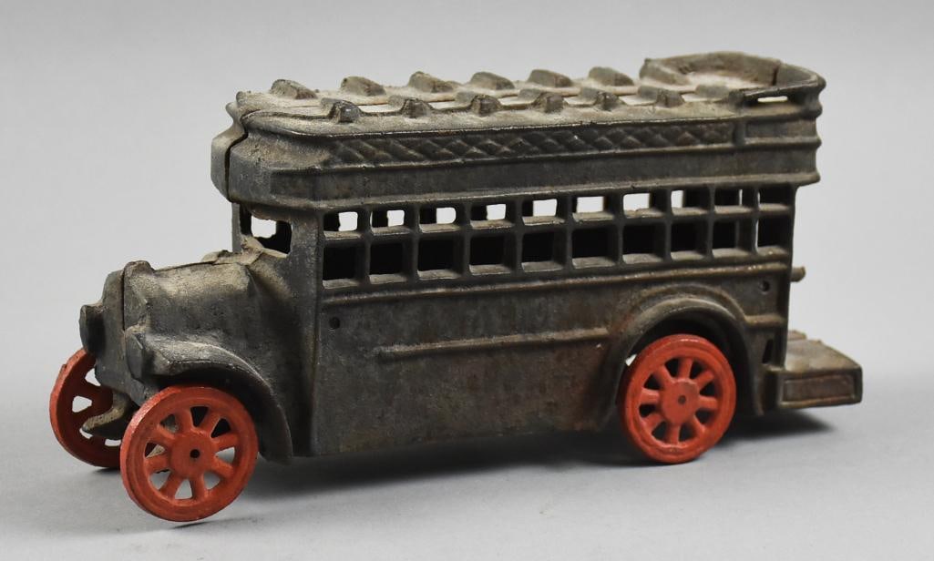 c1960 Cast Iron Double Decker Bus: This vintage bus is cast iron. Double decker style with red painted wheels. It is vintage from the 1960s originally created by AC Williams in the 1920s and 30s. Measures approx. 5" x 11",