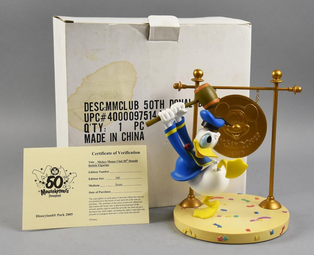 2005 Donald Duck 50 Years Mickey Mouse Club Bobble COA MIB: This is an adorable Donald Duck bobble figure commemorating 50 Years of the Mickey Mouse Club. Donald appears resin, holds a mallet and is swinging it to a gong. He is a limited edition of only 300 ma