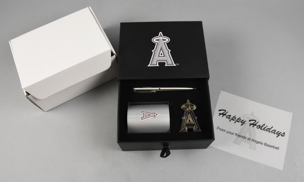 Anaheim Angels Holiday Desk Set in Original Box: Great set from the Anaheim Angels. This desk set includes a pen, A insignia that appears to be a paperweight and cup with Angels logo on one side and Ohtani and Trout shaking hands on the other.